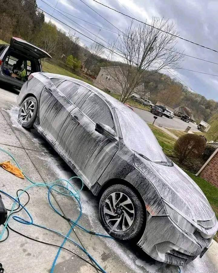 Sedan covered in snow foam